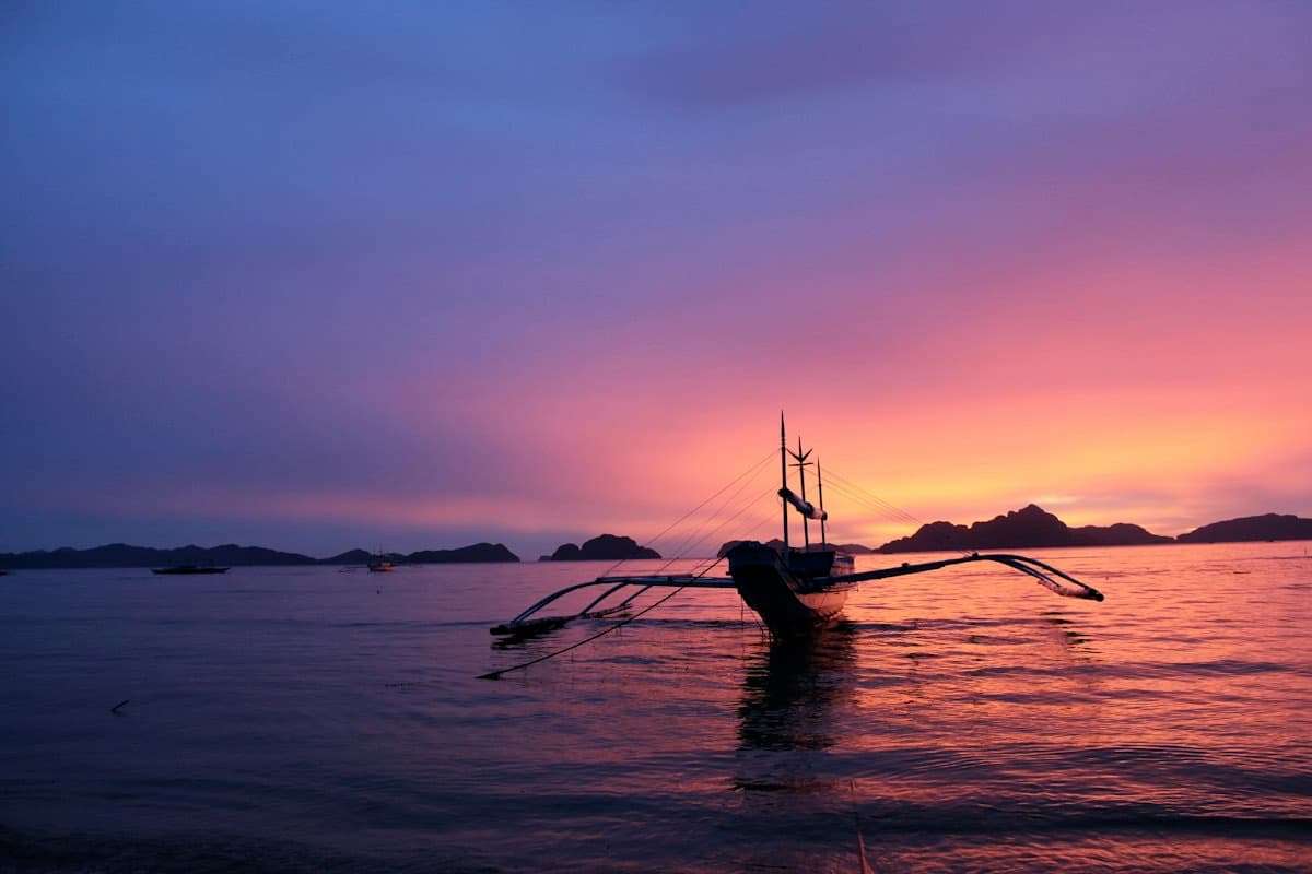 Sample photo: a boat on the water at sunset